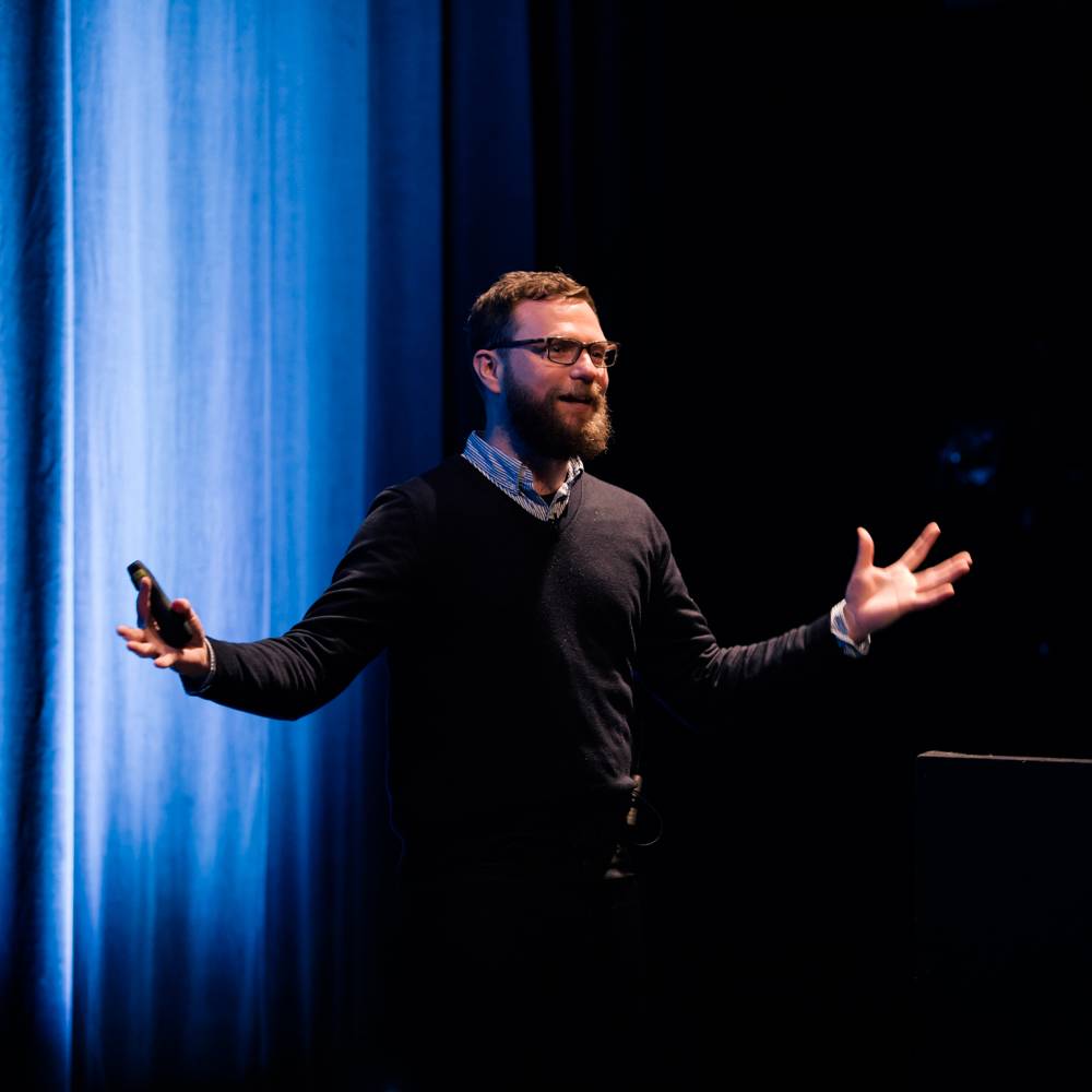 A UX London speaker delivers a talk.